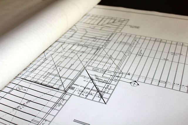Renovation blueprints and house plans spread on a table